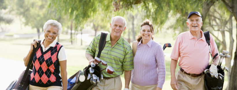 Senior friends golfing together