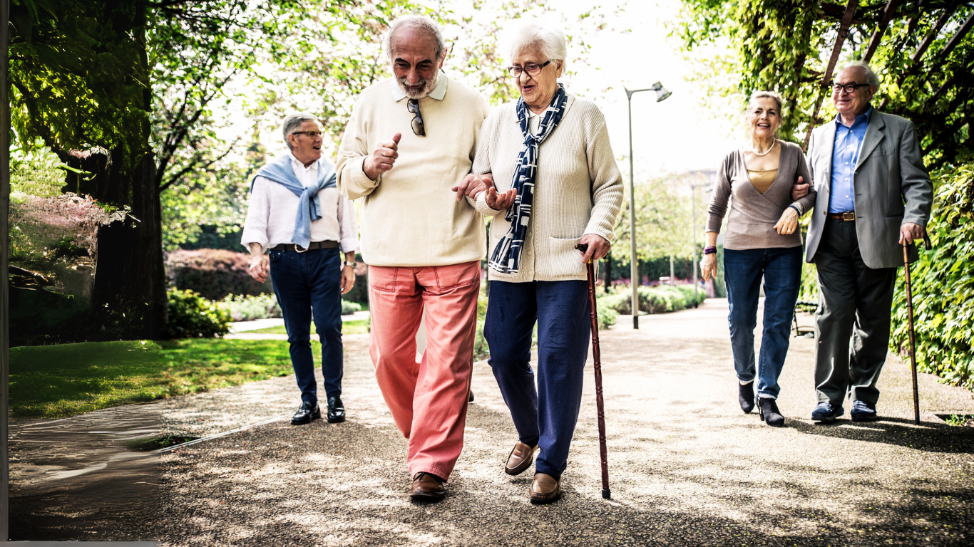 Blog Images (86) Senior man walking with a senior woman with a cane outside