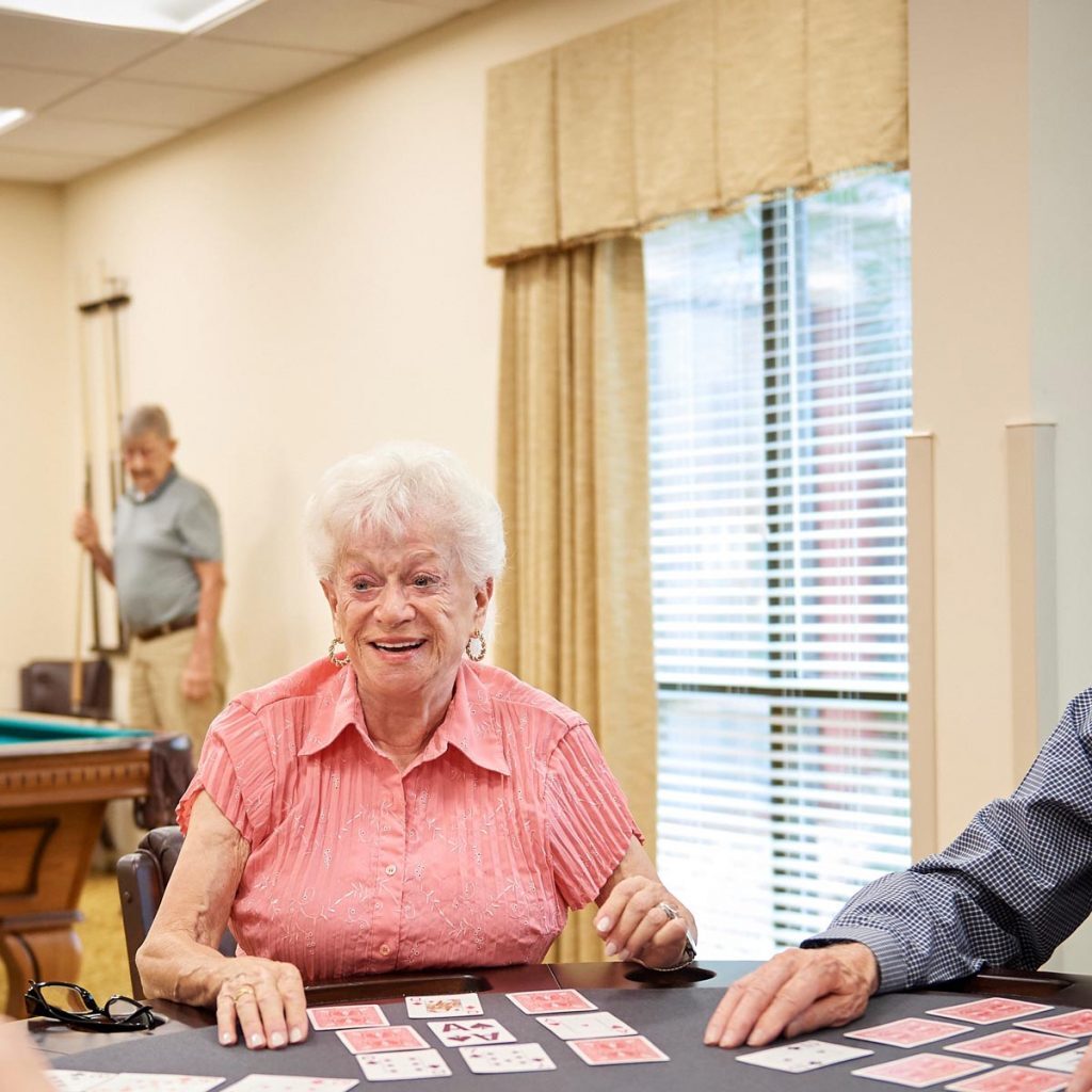 Senior residents playing card games.