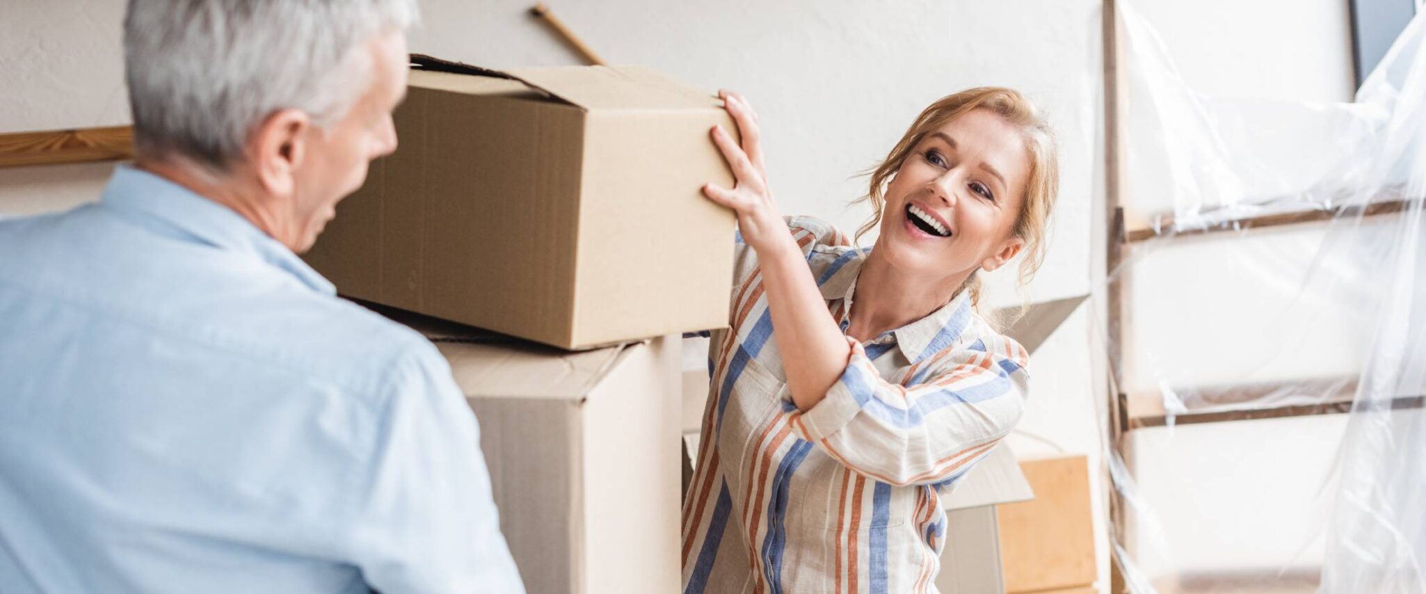 senior and his daughter help him move into a senior living community