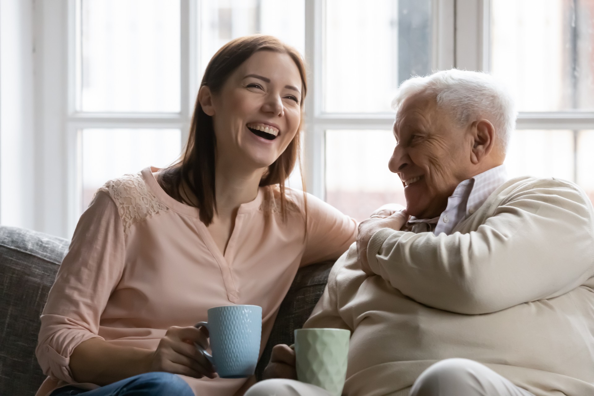 Father and daughter enjoying a cup of coffee.