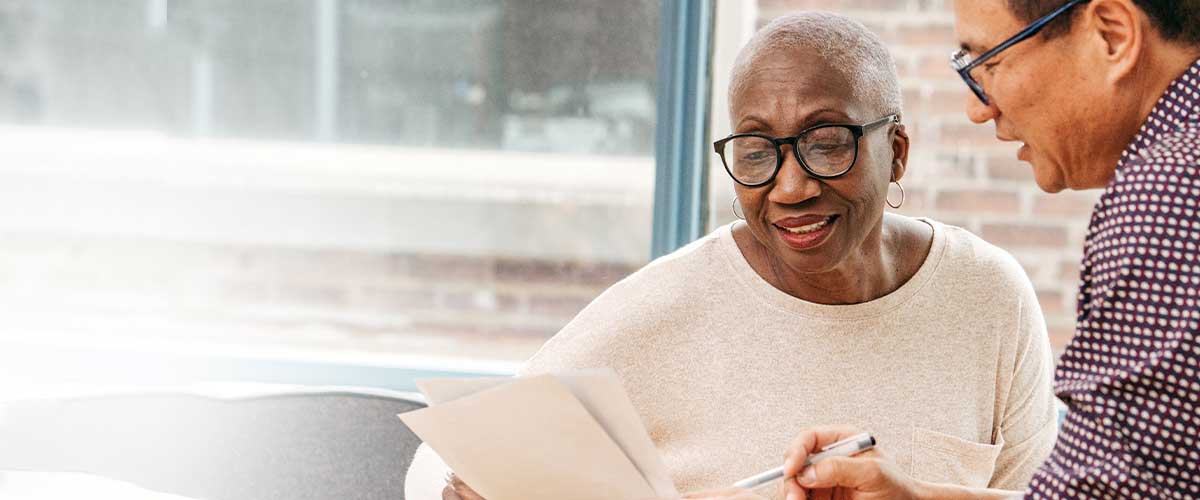 Senior woman going through paperwork