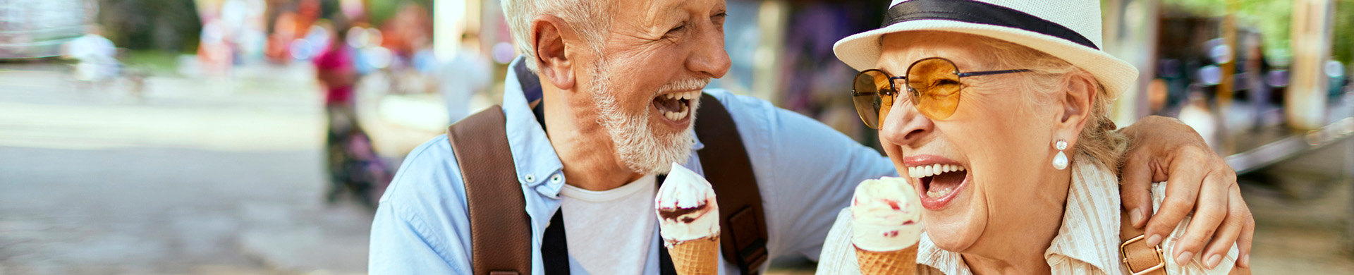 A senior couple enjoying ice cream cones 