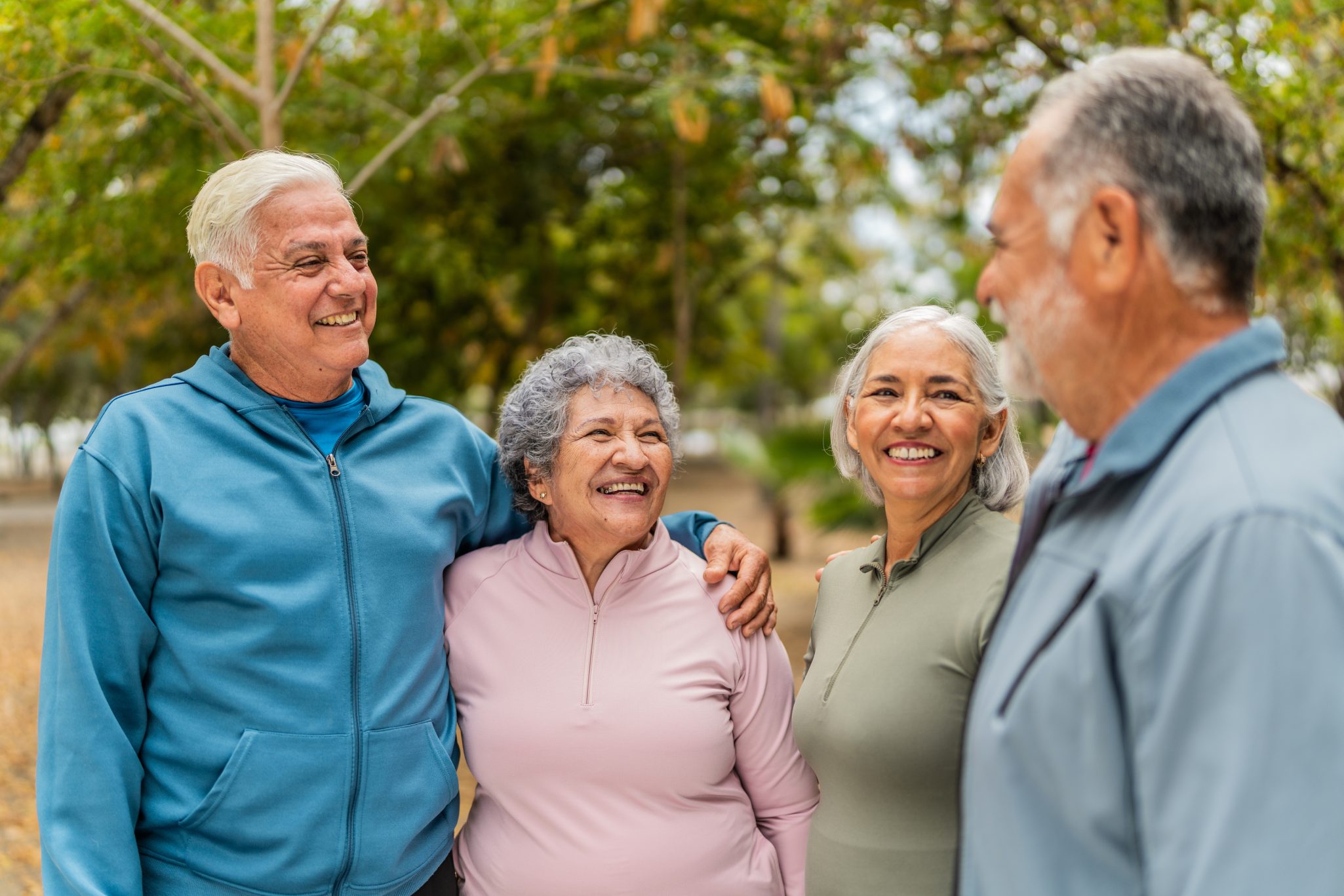 Group of smiling senior friends on outdoor walk